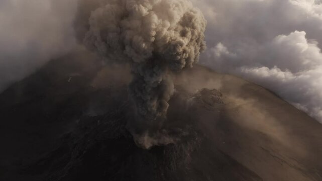 Aerial view of erupting volcano with smoke and crater, Fuego, Chimaltenango, Guatemala.