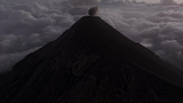 Aerial view of erupting Volcano Fuego with dramatic smoke and clouds, Chimaltenango, Guatemala.