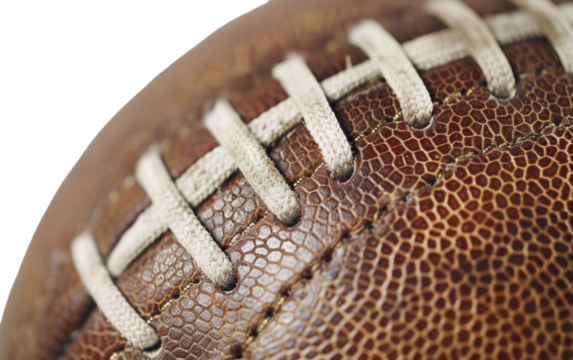 Closeup shot of the laces and leather of a worn football - Powered by Adobe