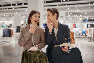 Happy smiling woman friends having nice conversation during shopping time