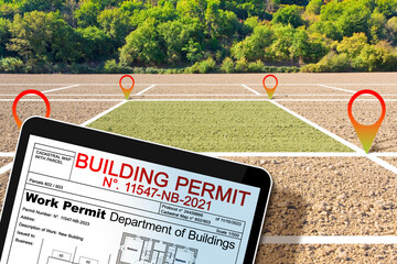 Buildings Permit concept with vacant land available for building construction, work permitl on digital tablet - Building activity and construction industry concept with residential building project
