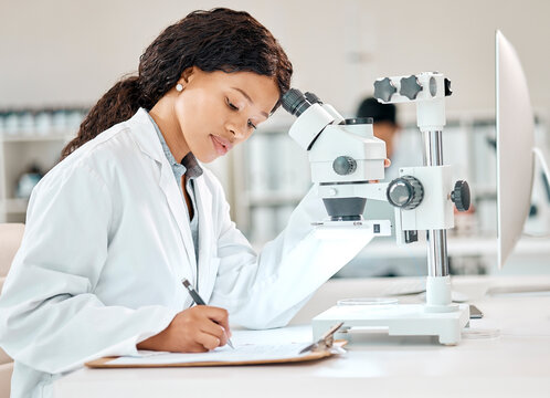 Woman, documents and microscope in laboratory for research, analysis and medical career. Scientist, professional and notes or writing for innovation with technology in hospital for report and review