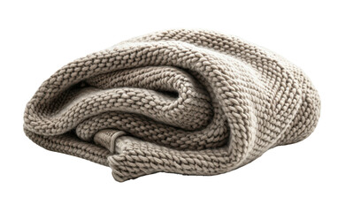 A soft, beige knit blanket rolled up on a white background