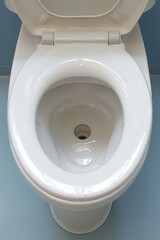 Closeup of a clean white toilet, emphasizing hygiene and modern bathroom design, suitable for home interiors and sanitation
