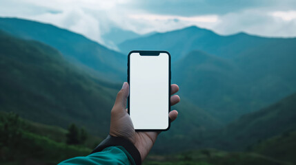 Person Holding Smartphone With Blank Screen In Front Of Green Hills, Cloudy Sky Background, Mockup