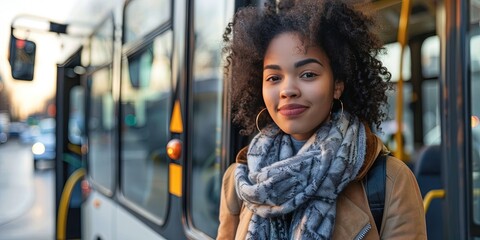 young woman getting on bus to travel