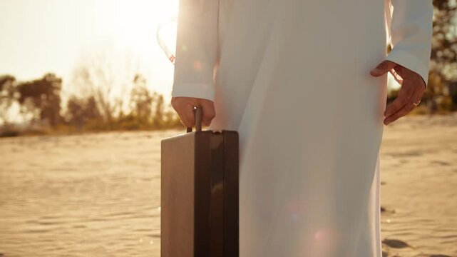 Details Of The Sheik Hand Holding A Briefcase