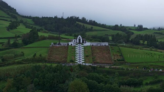 Aerial view of old church on hill with greenery and countryside, Ermida de Nossa Senhora da Paz, Azores, Portugal.