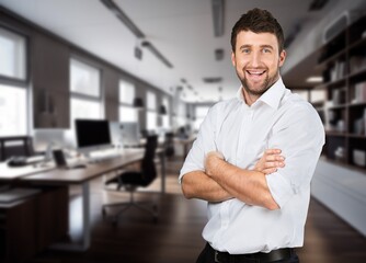 Happy business man looking at camera posing