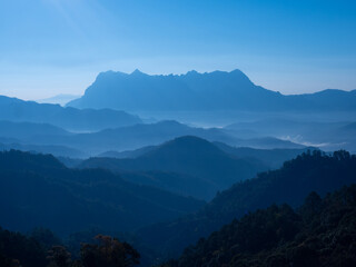 Fototapeta premium Doi Luang Chiang Dao mountain at dawn with blue tone sunrise sky. Chiang Mai - Thailand