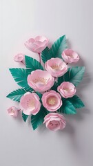 Pink paper flowers and green leaves on white background