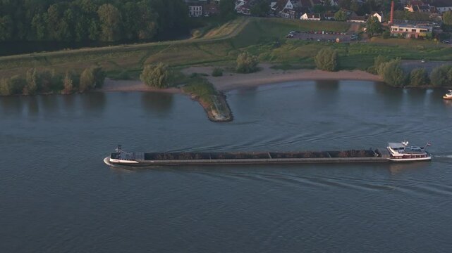 Aerial view of tranquil river Waal with city of Zaltbommel at sunrise, Gelderland, Netherlands.