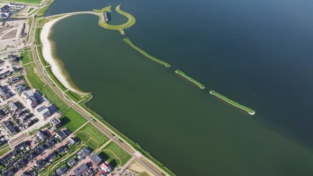 Aerial view of Tulpeiland island with tulip shape, Wolderwijd lake, and residential homes, Zeewolde, Netherlands.