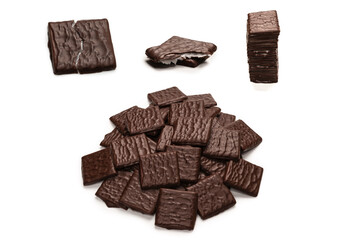 Dark chocolate candies isolated on white background.