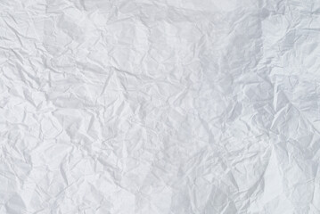Crumpled white paper background.