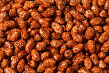 Tasty sweet roasted peanuts as a background.