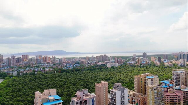 Aerial cityscape with highrise buildings near sea