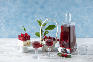 Cherry liqueur in a carafe and glasses