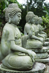 Fototapeta premium Stone buddha statue, close up. Buddhism.
