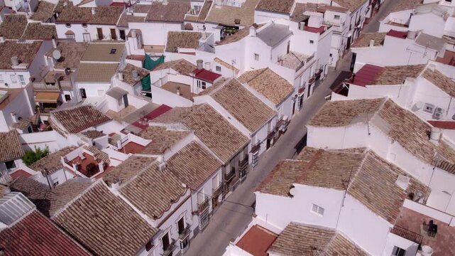 Aerial view of traditional white town with church and castle, Olvera, Cadiz, Spain.