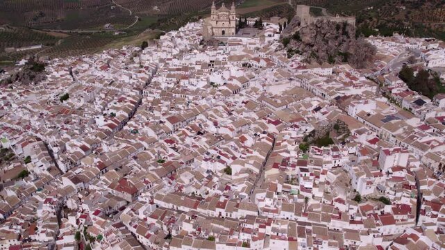 Aerial view of picturesque town with white church and castle, Olvera, Cadiz, Spain.