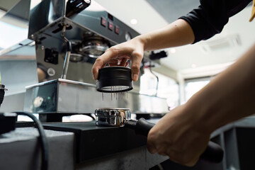 Barista Preparing Espresso with Professional Coffee Machine in Modern Cafe Setting
