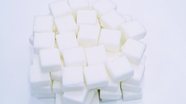 High angle view rotation of sugar lumpy close-up