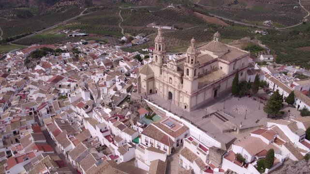 Aerial view of picturesque Olvera with white church, castle, and quaint houses, Andalusia, Spain.