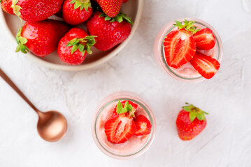 Tofu and strawberry pudding dessert in a glass. Vegan food. Lactose and sugar free. Top view.