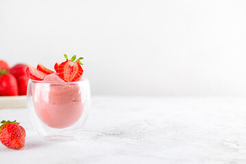 Tofu soy strawberry yogurt dessert in a glass. Vegan homemade food. Lactose and sugar free. Copy space.