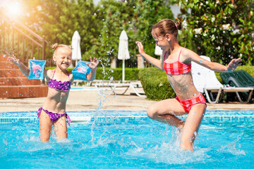 Children Pool for Family Vacation. Activity Children Having fun Playing in Small Pool Outdoor with...