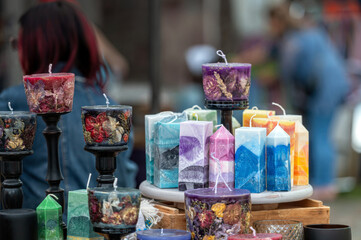Colorful candles at a craft market. Background with selective focus and copy space.