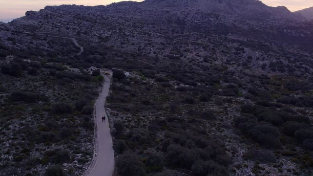 Aerial view of El Torcal nature reserve with mountain road and rocks, Malaga, Spain.