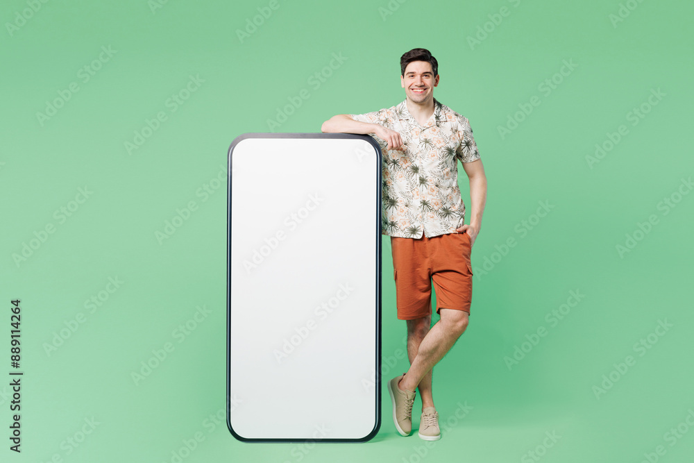 Wall mural full body young man wear white shirt casual clothes stand near big huge blank screen mobile cell pho