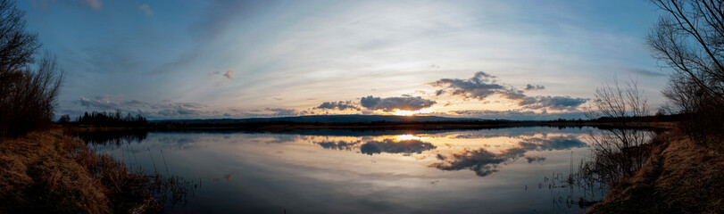 Panorama lake view in sunrise time .Sunrise at the lake