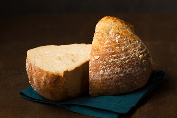Delicious homemade bread cut in half. Still life in a rustic style