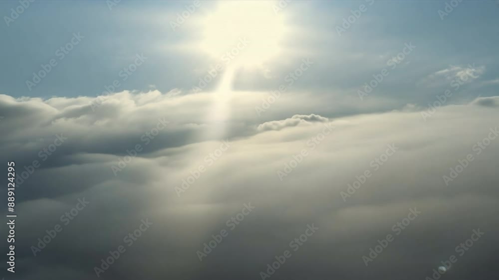 Poster The sky is cloudy and the sun is shining through the clouds. The sun is casting a warm glow on the clouds, creating a peaceful and serene atmosphere