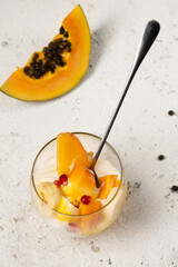 Dessert with tropical fruits in transparent glasses