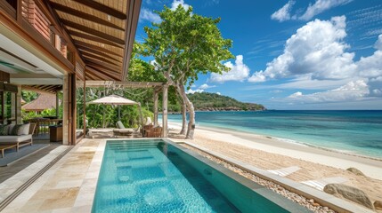 Fototapeta premium A luxurious beachfront villa with open-air living spaces, a private infinity pool, and views of a pristine, sandy beach and turquoise waters