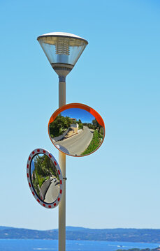 Reflection of a man with a camera in the mirror