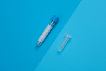Medical test tubes on blue background