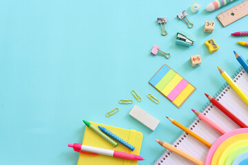 Fototapeta premium education and back to school concept. stationery over blue background. top view, flat lay