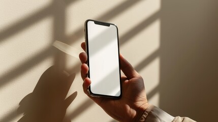 a studio photo of women right hand holding an iphone with green screen, A beige seamless background with a sunlight feel. Dramatic lighting,