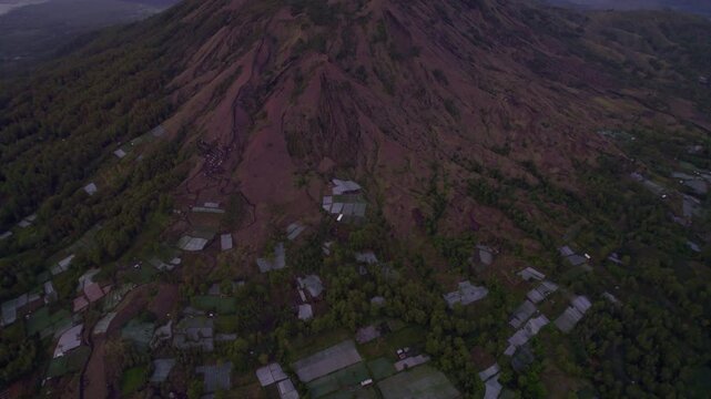 Aerial view of majestic Mount Batur at sunrise, Pinggan, Bali, Indonesia.