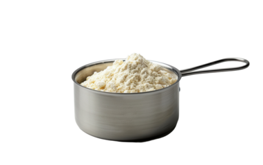 A Single Stainless Steel Measuring Cup Filled With White Powder