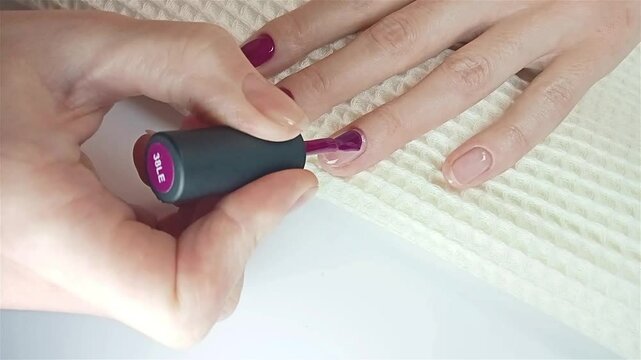 Step-by-step guide on how to apply gel polish. Step 8 Nails gel polish. The process of correctly applying gel polish to the nail and capping the free edge. Manicure by yourself at home concept 