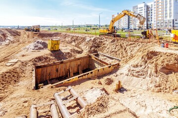 Fototapeta premium Construction Site with Heavy Machinery