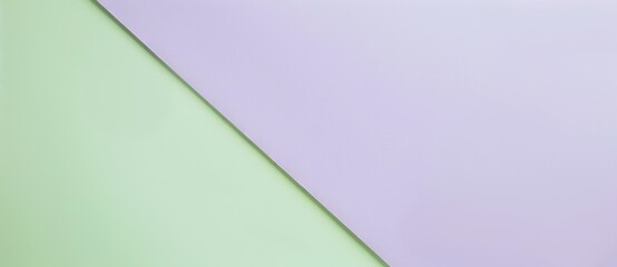 Fototapeta premium Minimalist image featuring a green and purple background divided by a diagonal line, offering space for text or design elements