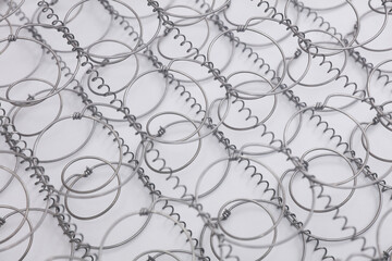 Bed springs on white background close up