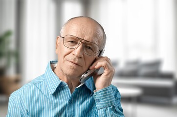 Senior happy old man portrait in room